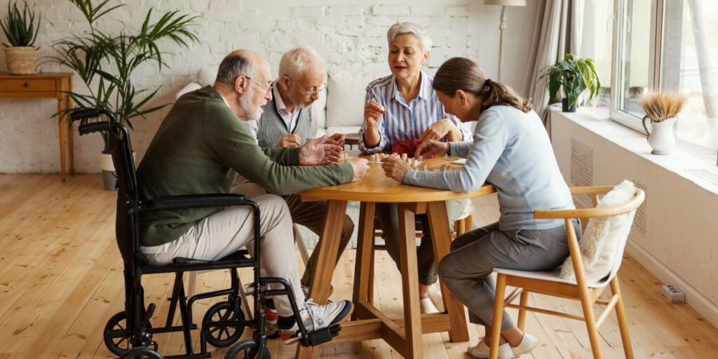 A group of friends playing bingo at the dementia care in Glendale